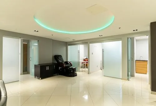 Frosted-glass private treatment rooms with adjoining kitchenette