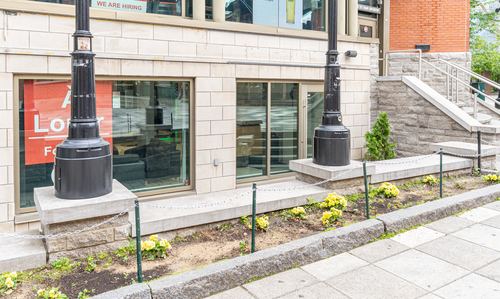 Street-level storefront entrance on Promenade du Portage