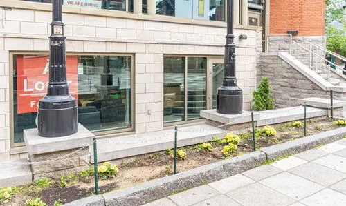 Street-level storefront entrance on Promenade du Portage
